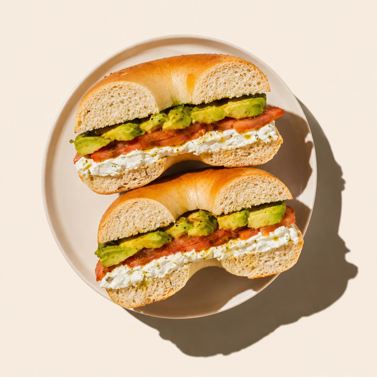 C.T.A — cream cheese, tomatoes, avocado, lemon pepper on a fresh bagel